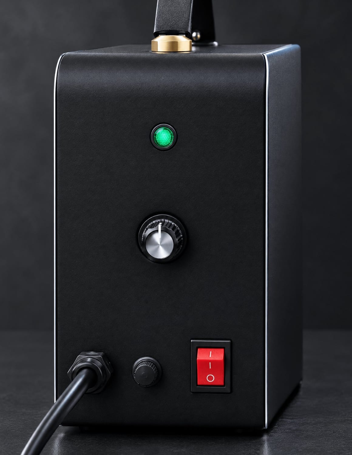 Stepless dial control with green indicator and red rocker switch on JBS barber steamer