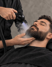 Professional beard steam treatment with subtle Nano Blue Light for pre-shave beard preparation